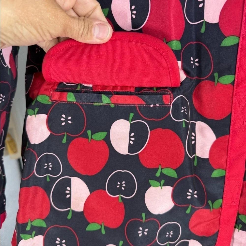 Gymboree lined raincoat with accessible zelcro closures. Apple print 7-8 Y